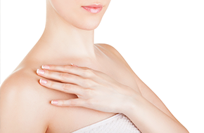 woman holding her upper chest part