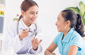 female doctor talking to a woman